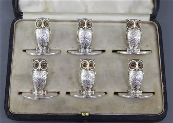 An Edwardian cased set of six novelty silver owl menu holders, by Sampson Morden & Co, 32mm.